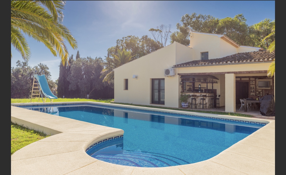 Mediterranean finca with swimming pool and palm trees